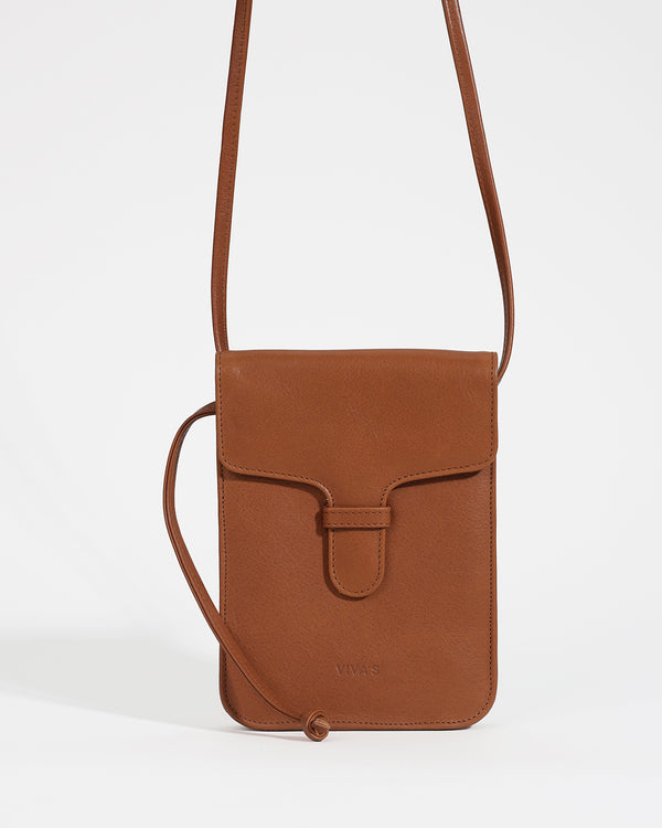 Brown leather crossbody bag on a white background