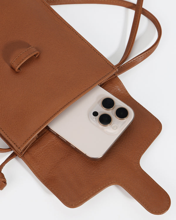 Brown leather phone case with a phone inside on a white background