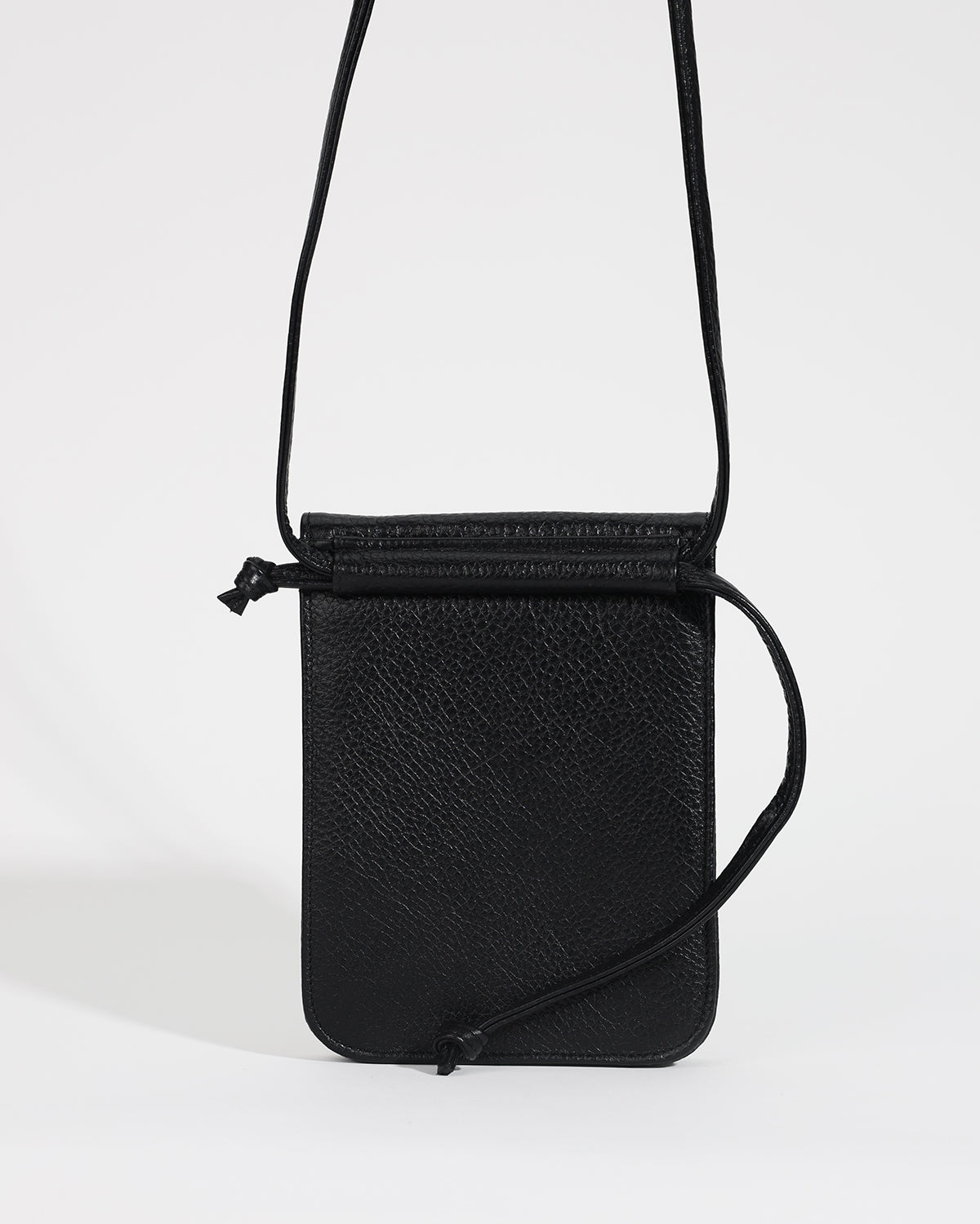 Black crossbody bag on a white background