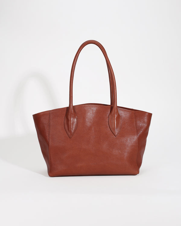 Brown leather tote bag on a white background