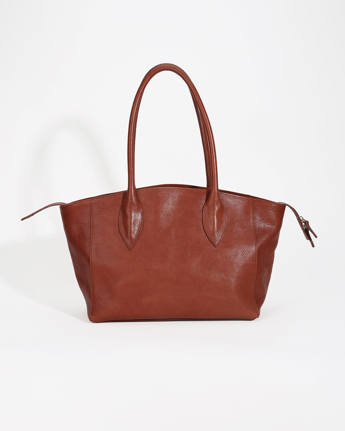 Brown leather handbag on a white background
